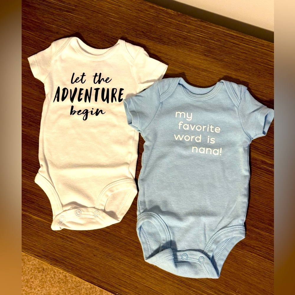 Two Carter’s Newborn Onesies